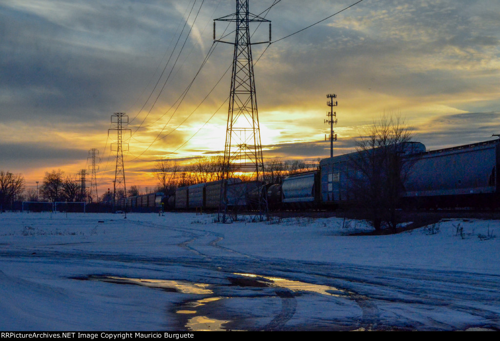 Train passing by at the sunset